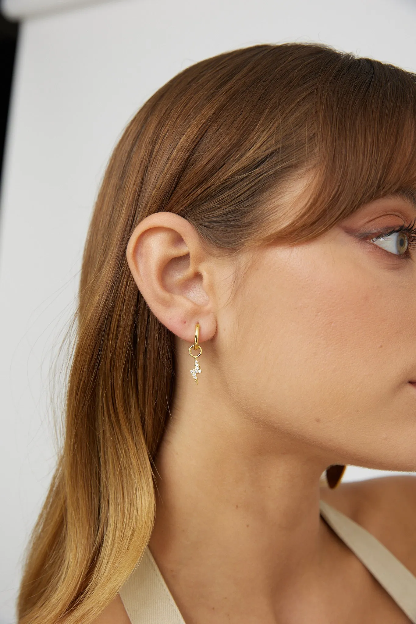 Celeste Lightning Zircon Earrings Gold